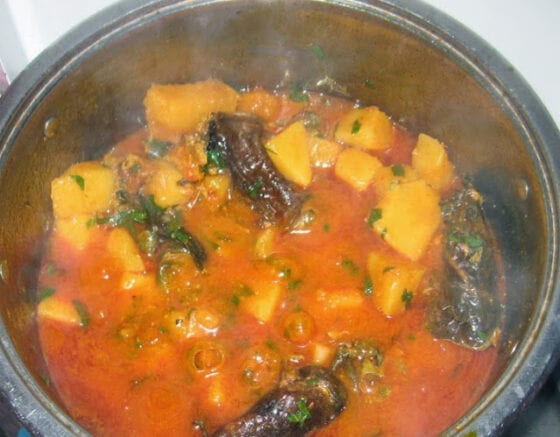 Pot of yam cooked with scent leaves 
